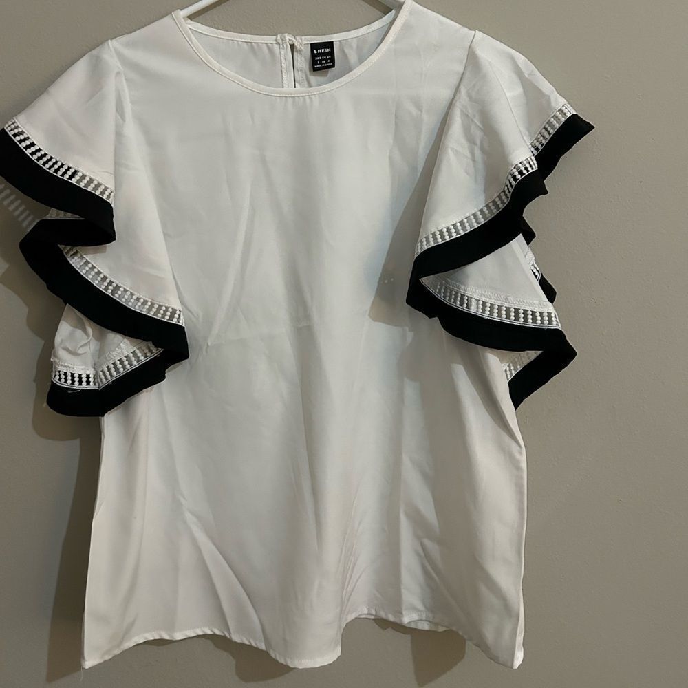 Shein white ruffle sleeve loose blouse with black detailing.